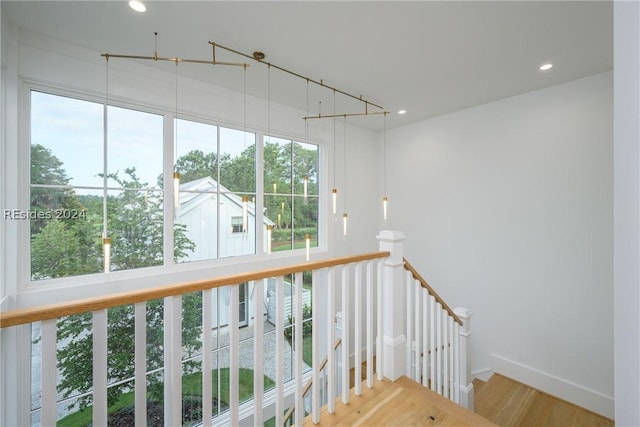 stairway featuring wood-type flooring