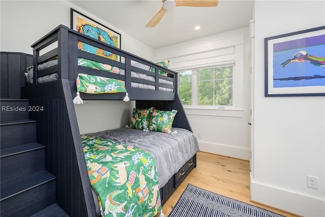 bedroom featuring hardwood / wood-style flooring and ceiling fan