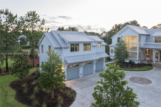 modern inspired farmhouse with a garage