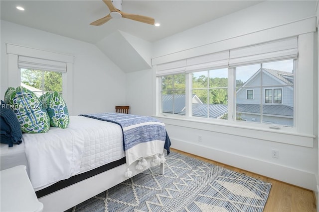 bedroom with hardwood / wood-style floors and ceiling fan