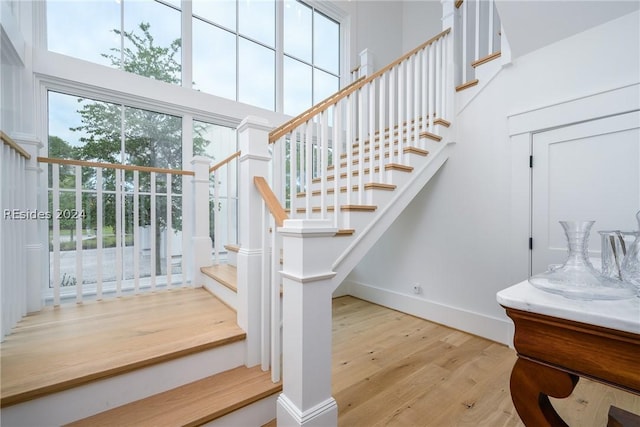 staircase with wood-type flooring