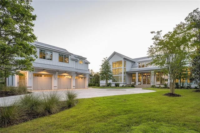 exterior space featuring a garage and a front yard