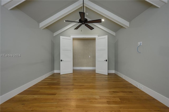 interior space with lofted ceiling with beams, light hardwood / wood-style floors, and ceiling fan