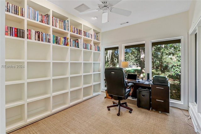 office with light colored carpet and ceiling fan