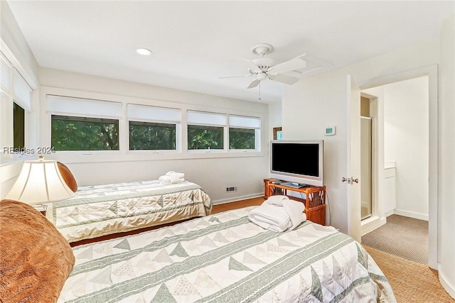 bedroom with ceiling fan and carpet flooring