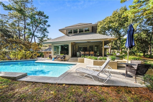 view of swimming pool with a patio