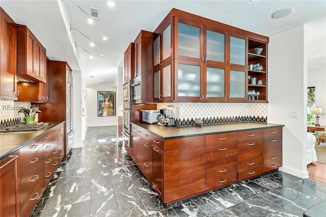 kitchen featuring tasteful backsplash and oven