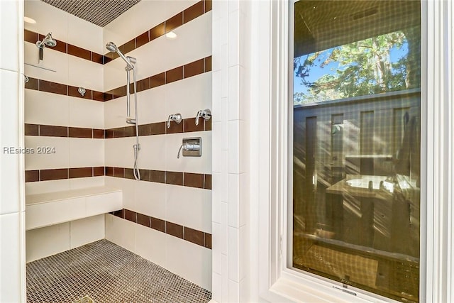 bathroom featuring tiled shower