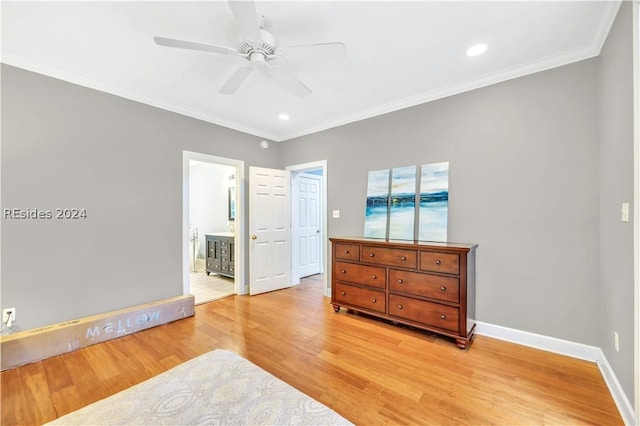 bedroom featuring light hardwood / wood-style flooring, ornamental molding, ceiling fan, and ensuite bathroom