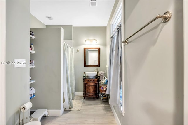 bathroom with vanity and a shower with curtain