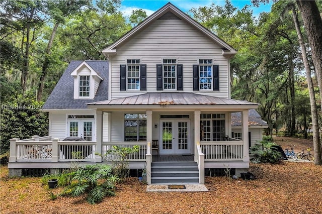 rear view of house featuring a porch and french doors