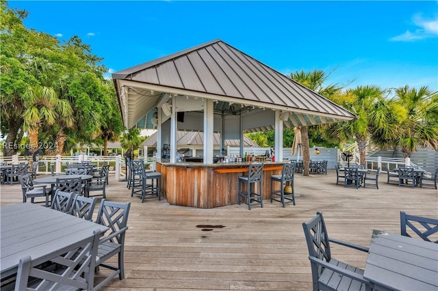 wooden terrace with a gazebo and an outdoor bar