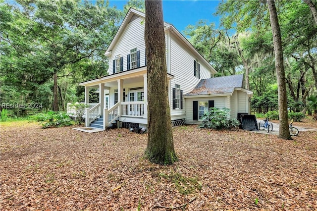 back of house with covered porch