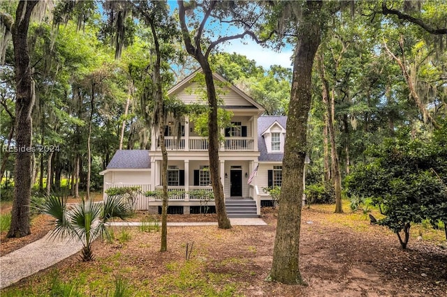 view of front of property with a balcony and covered porch