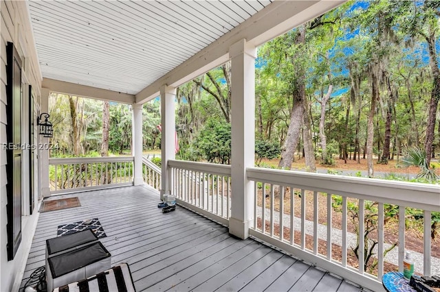 wooden terrace with a porch