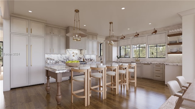 kitchen featuring pendant lighting, light stone counters, tasteful backsplash, and dark hardwood / wood-style floors