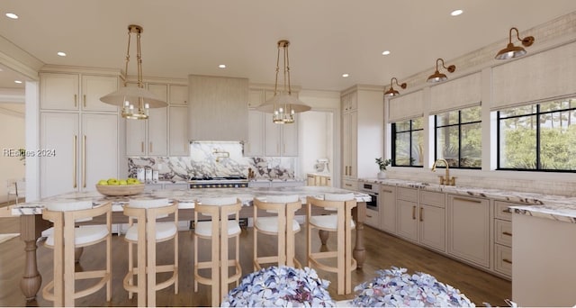 kitchen with decorative light fixtures, light stone countertops, decorative backsplash, and wall chimney exhaust hood