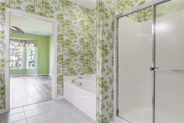 bathroom with tile patterned floors and plus walk in shower