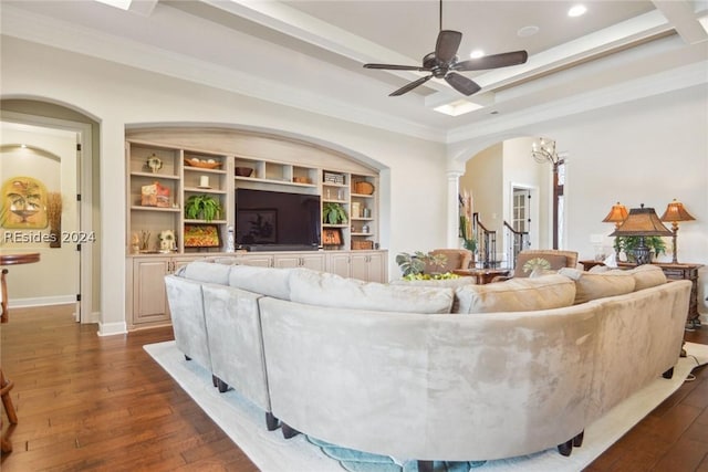 living room featuring ceiling fan, ornamental molding, dark hardwood / wood-style floors, and decorative columns