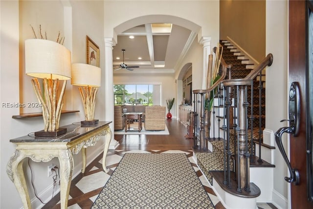 interior space featuring coffered ceiling, ornate columns, ceiling fan, beam ceiling, and hardwood / wood-style floors