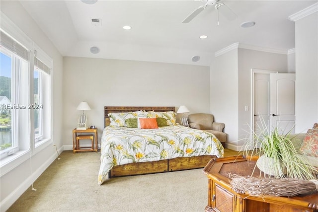 bedroom featuring multiple windows, ornamental molding, carpet flooring, and ceiling fan