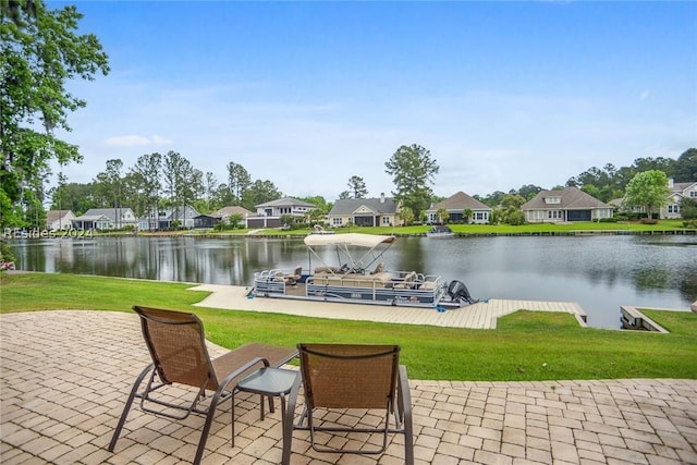 exterior space featuring a water view and a lawn