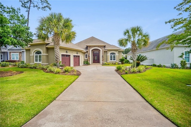 mediterranean / spanish home with a garage and a front yard