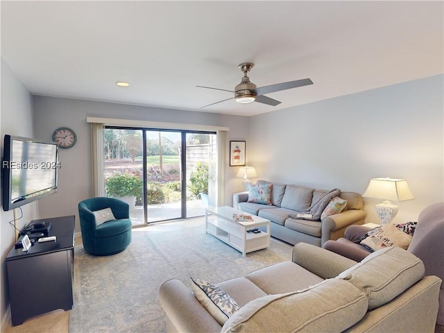 living room featuring ceiling fan and light carpet