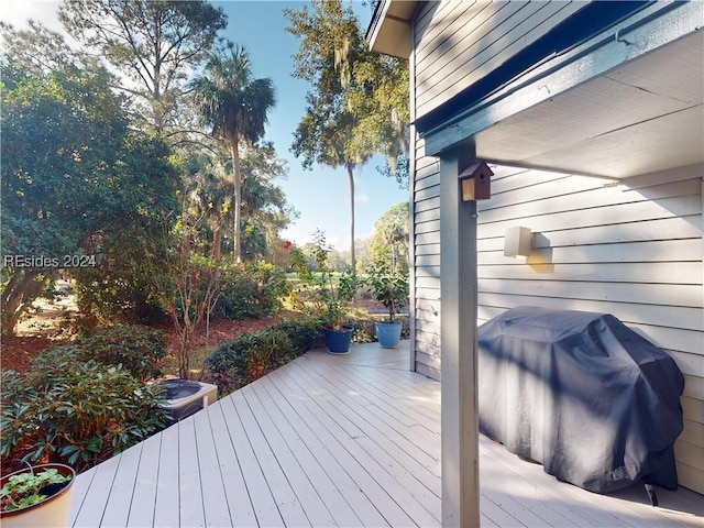 wooden terrace featuring area for grilling