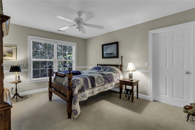 carpeted bedroom featuring ceiling fan