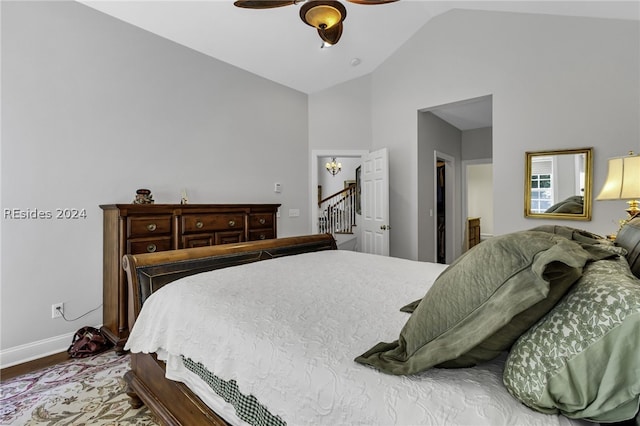 bedroom featuring vaulted ceiling, hardwood / wood-style floors, and ceiling fan