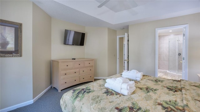 bedroom featuring ensuite bathroom, light carpet, and ceiling fan