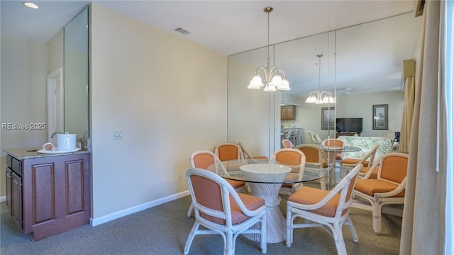 carpeted dining area with a notable chandelier