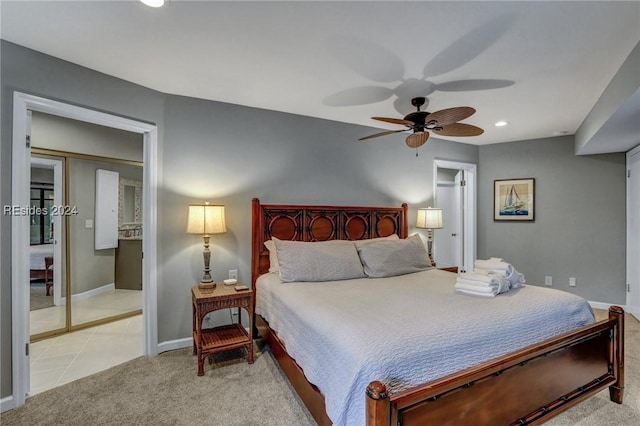 tiled bedroom featuring ceiling fan