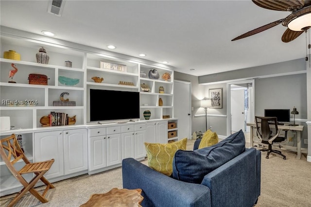 living room with ceiling fan and light carpet