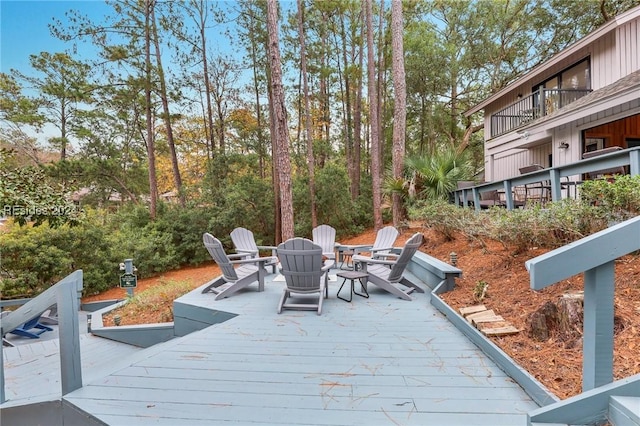 wooden deck featuring a fire pit