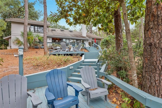 rear view of property with a deck