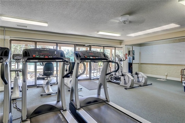 workout area featuring a textured ceiling