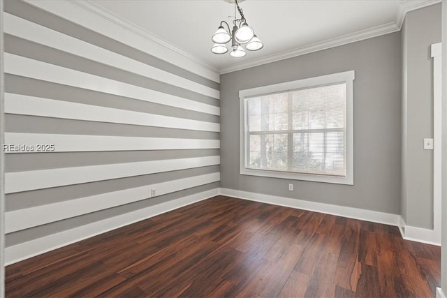 empty room featuring dark wood-type flooring, ornamental molding, and a chandelier