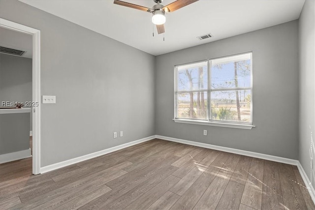 unfurnished room featuring ceiling fan and wood-type flooring