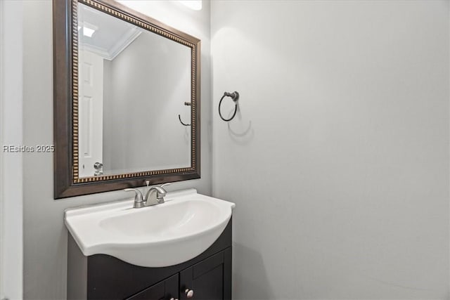 bathroom with crown molding and vanity