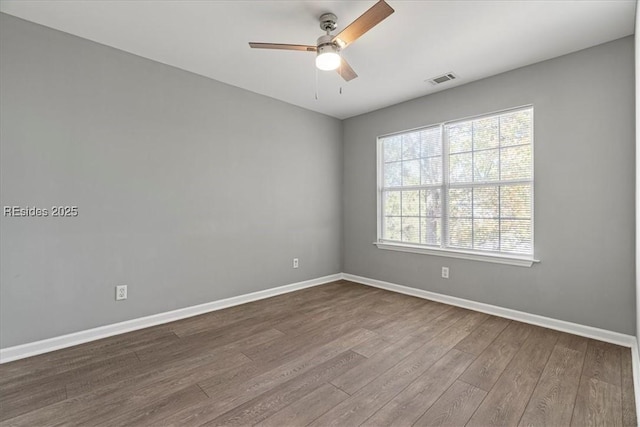 unfurnished room featuring hardwood / wood-style floors and ceiling fan