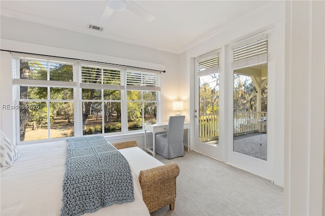 carpeted bedroom with ornamental molding, access to exterior, and ceiling fan