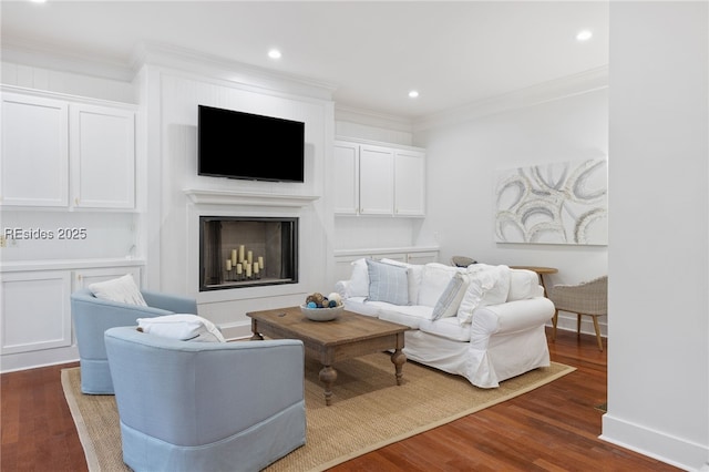 living room featuring dark hardwood / wood-style flooring and ornamental molding