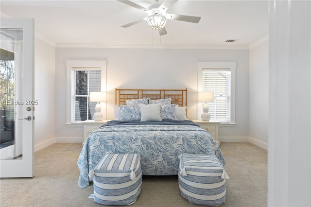 bedroom featuring ornamental molding, light colored carpet, and ceiling fan