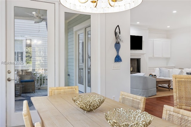 dining area with ornamental molding, hardwood / wood-style floors, and ceiling fan