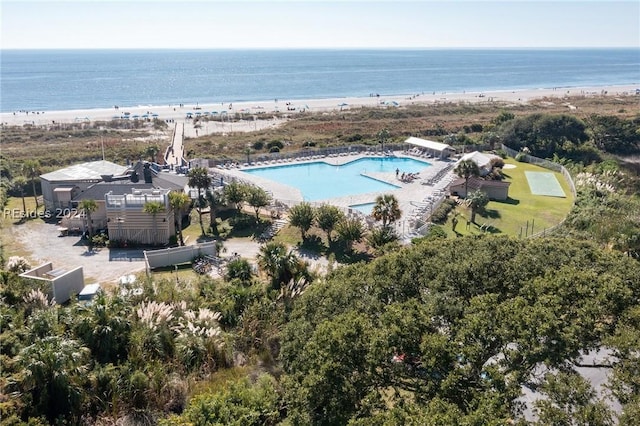 drone / aerial view with a water view and a view of the beach