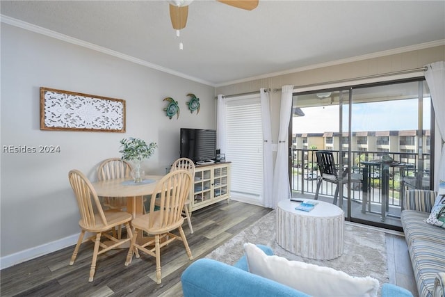 dining space featuring hardwood / wood-style floors, ornamental molding, and ceiling fan