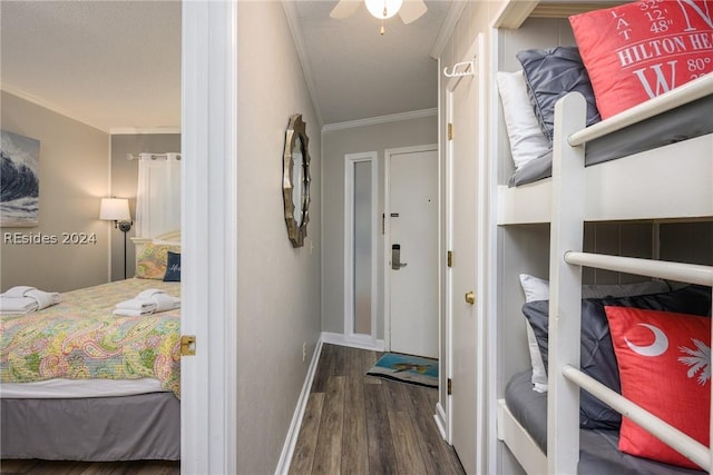 bedroom featuring crown molding, ceiling fan, and dark wood-type flooring