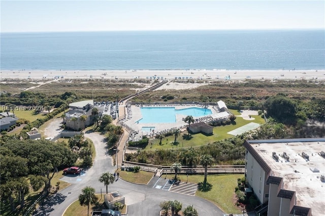 birds eye view of property featuring a view of the beach and a water view